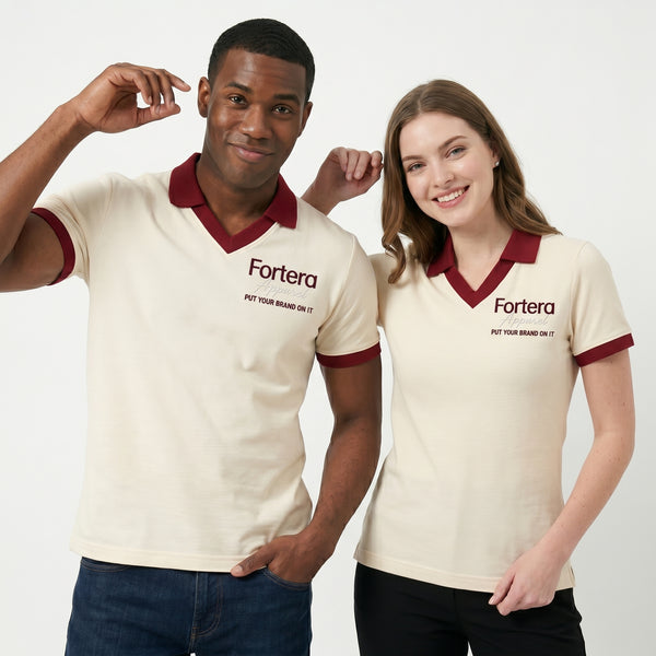 Cream custom staff polo shirt with burgundy heart collar V-neck accent - side view