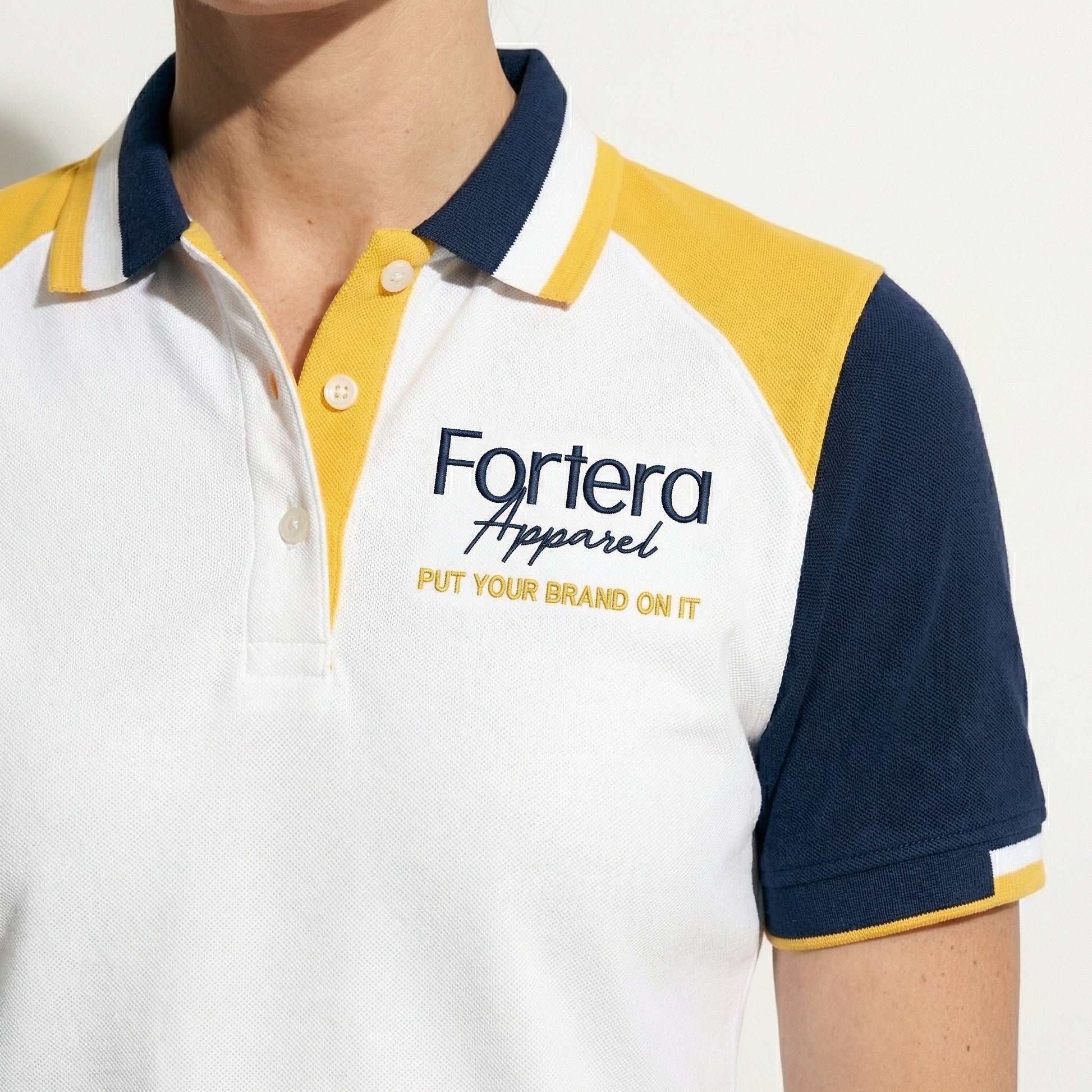 White bulk embroidered polo shirt with navy and yellow shoulder block - male fit
