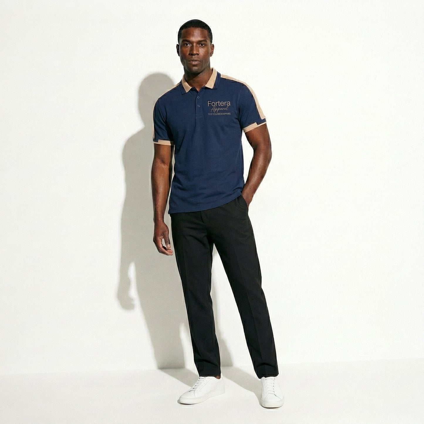 Navy bulk embroidered polo shirt with tan gold shoulder panel detail - detail close-up
