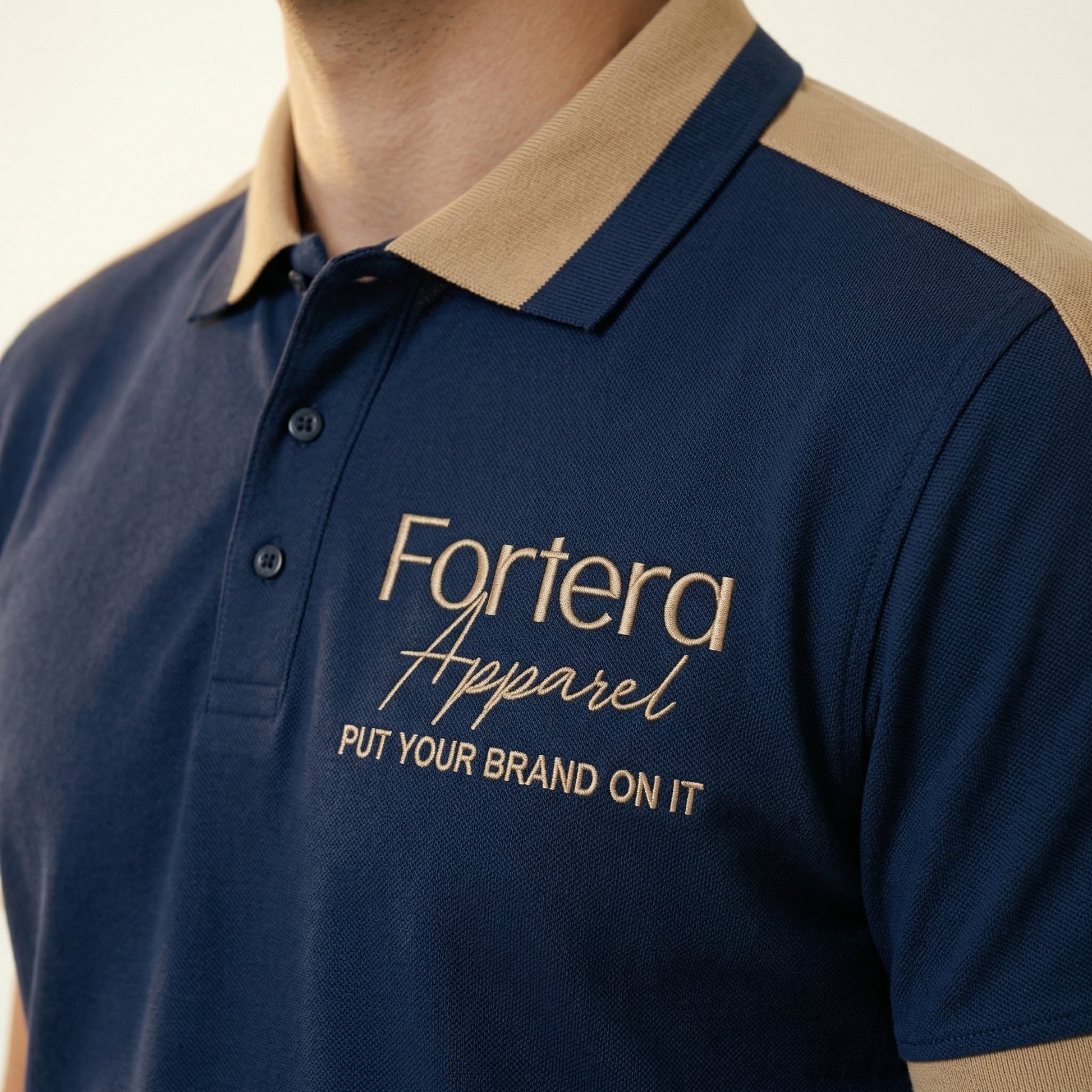 Navy bulk embroidered polo shirt with tan gold shoulder panel detail - male fit