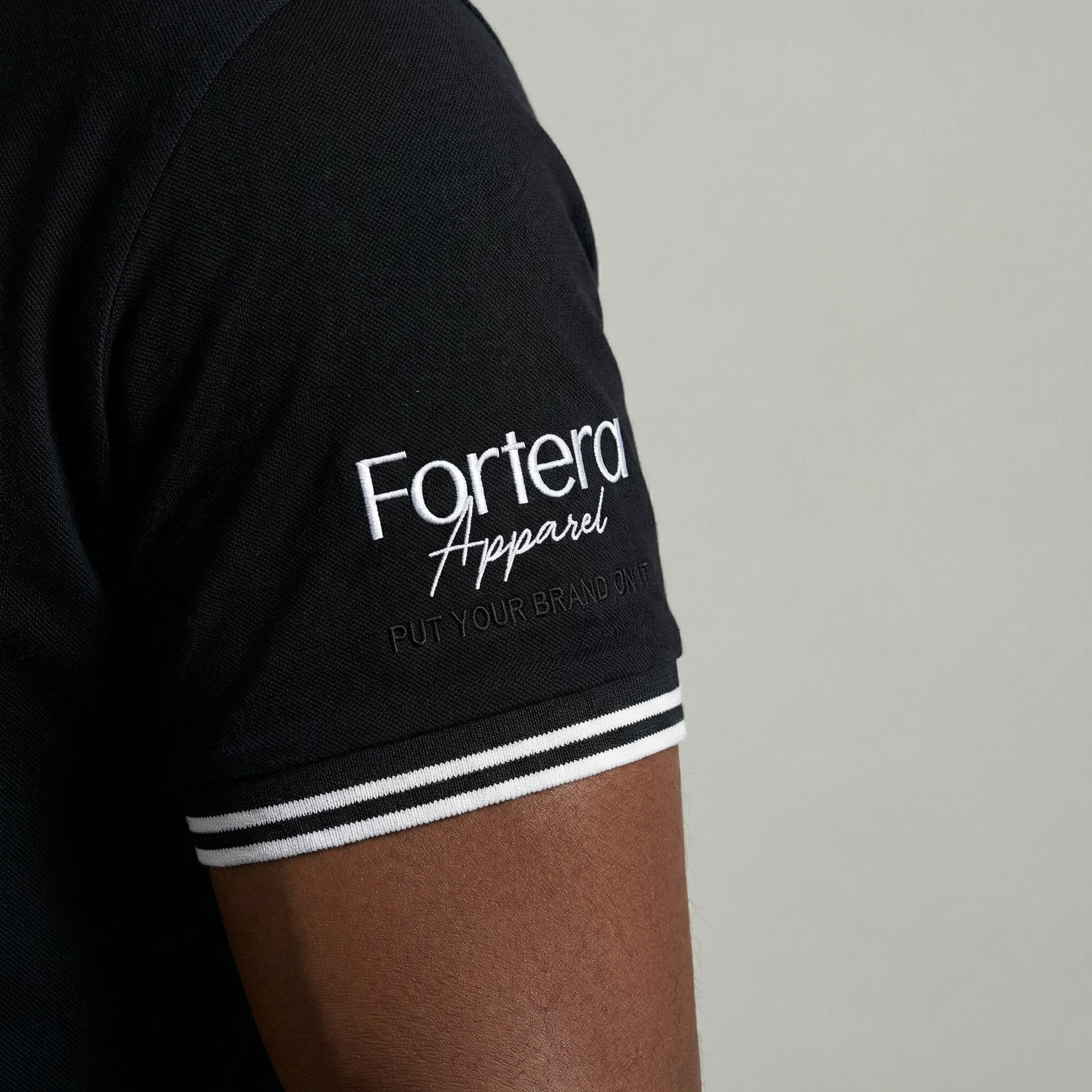 All black classic polo shirt with white tipping on collar and cuffs - team uniform group