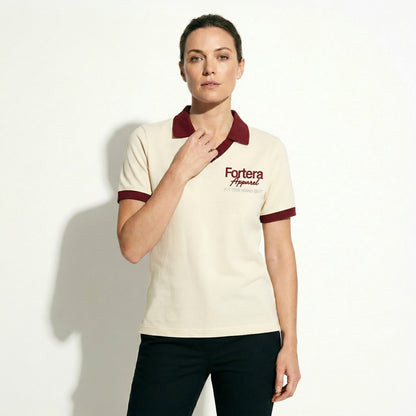 Cream custom staff polo shirt with burgundy heart collar V-neck accent - detail close-up