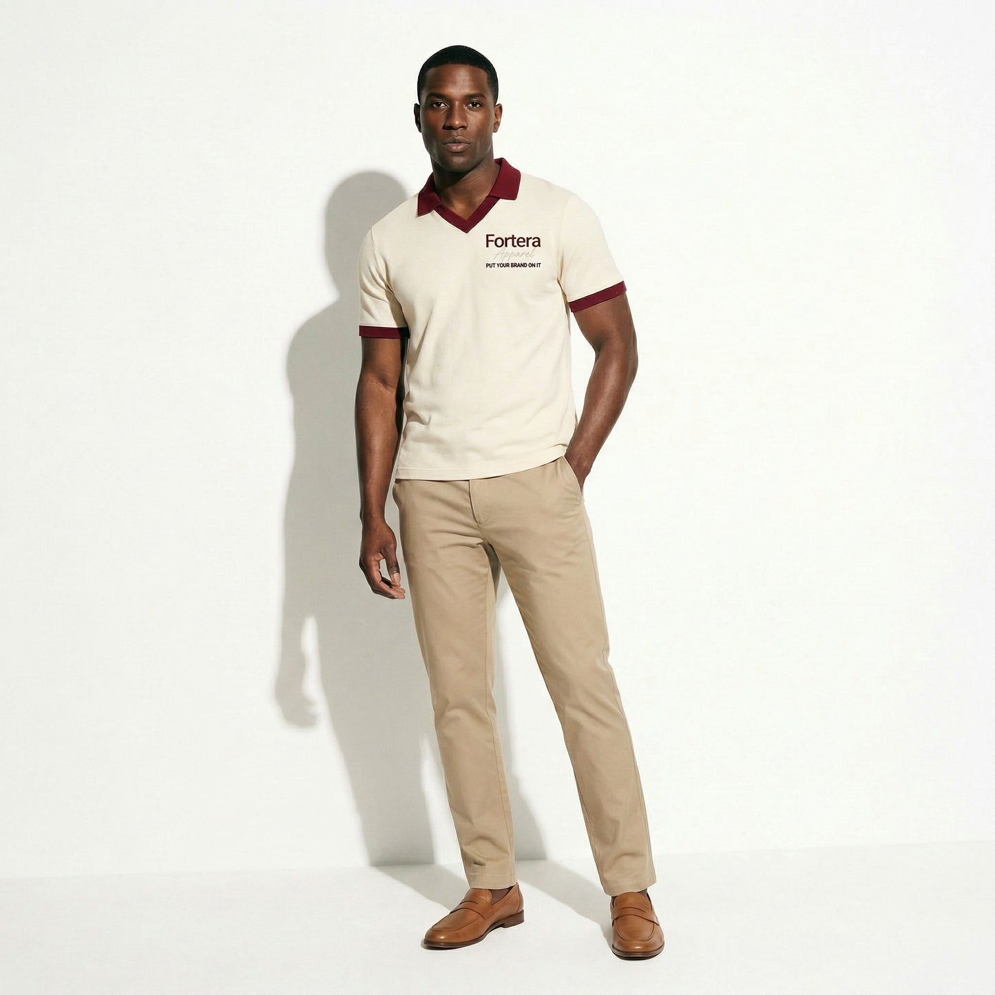 Cream custom staff polo shirt with burgundy heart collar V-neck accent - female fit