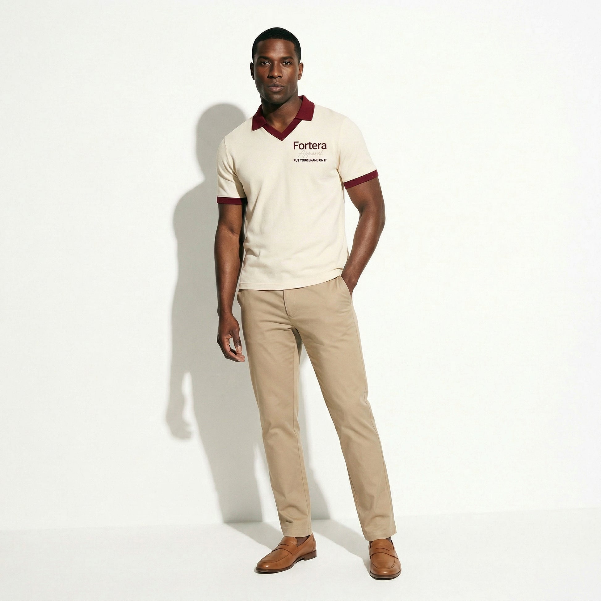 Cream custom staff polo shirt with burgundy heart collar V-neck accent - female fit