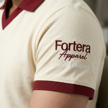 Cream custom staff polo shirt with burgundy heart collar V-neck accent - team uniform group