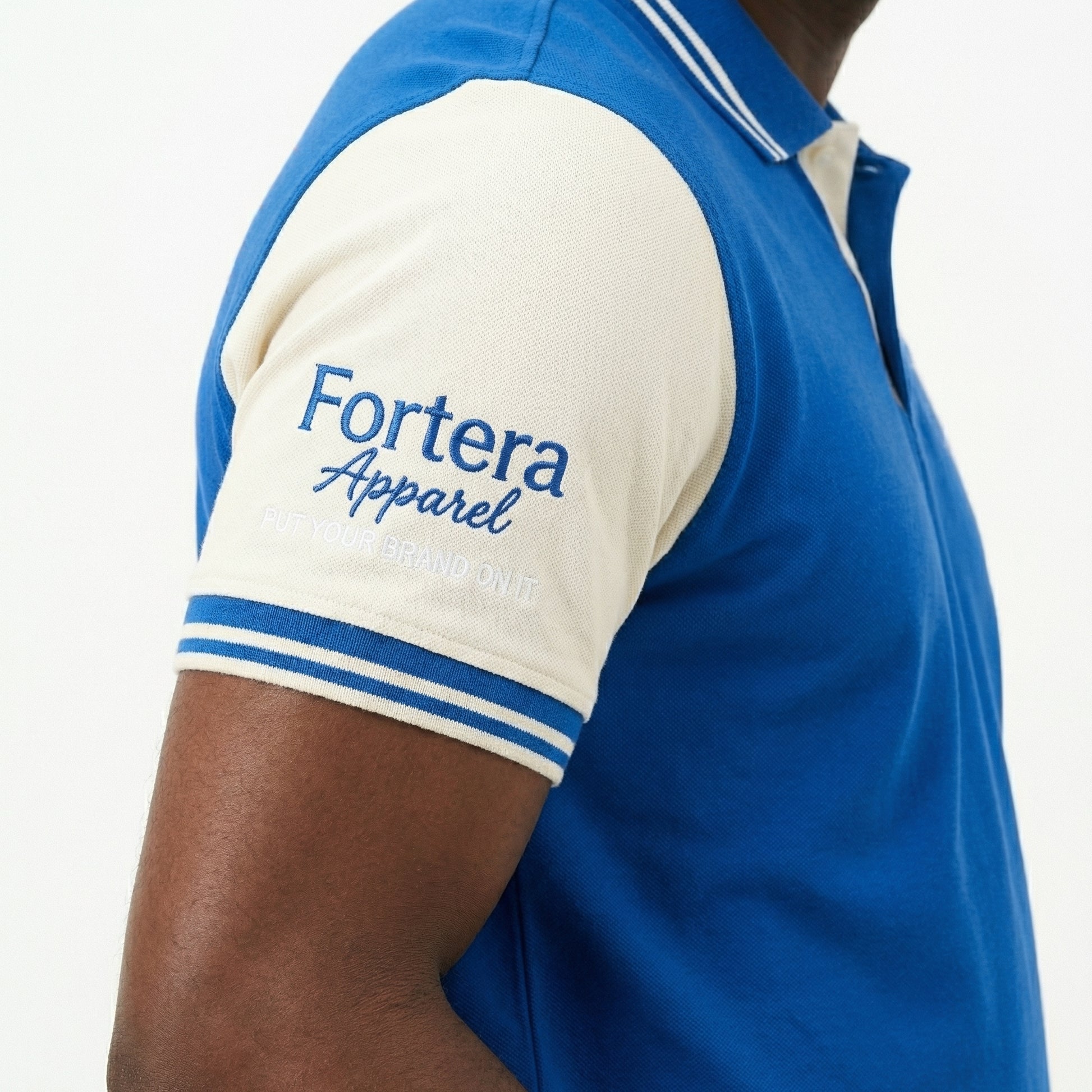 Royal blue custom staff polo shirt with white side panel and embroidered logo - team uniform group