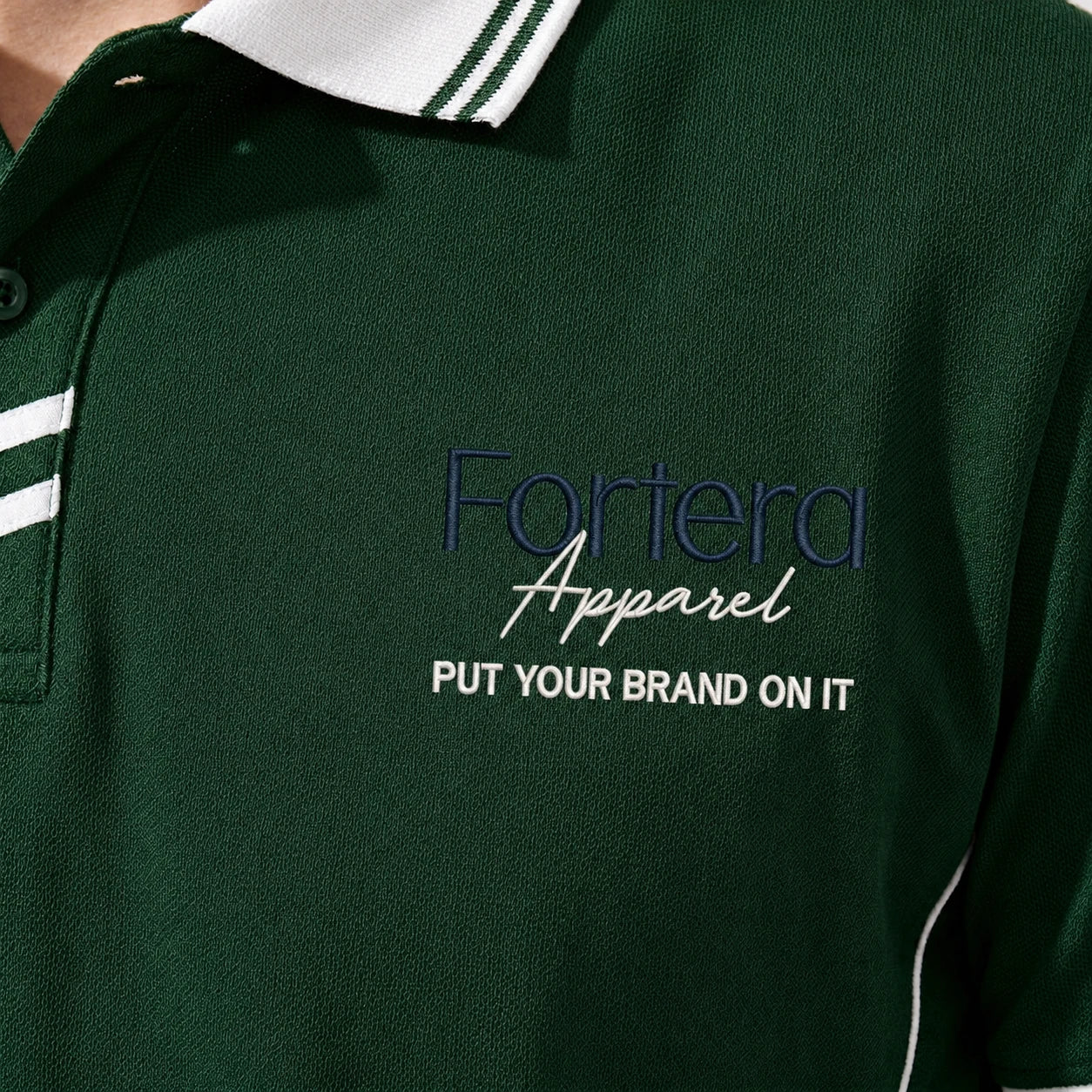 Close-up of embroidered chest logo on green custom polo shirt