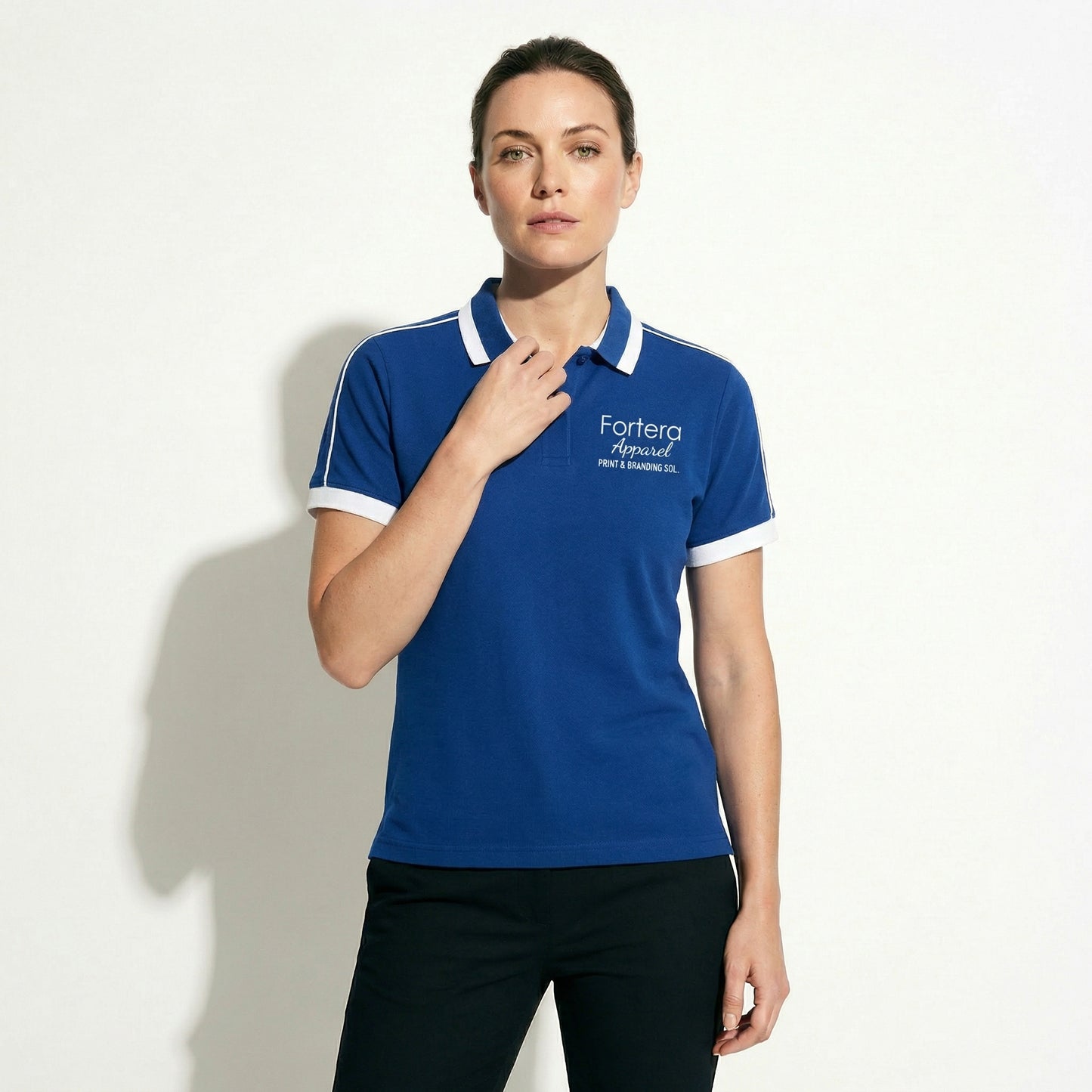 Royal blue embroidered polo shirt with white shoulder piping detail - female fit