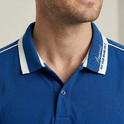 Royal blue embroidered polo shirt with white shoulder piping detail - logo embroidery detail
