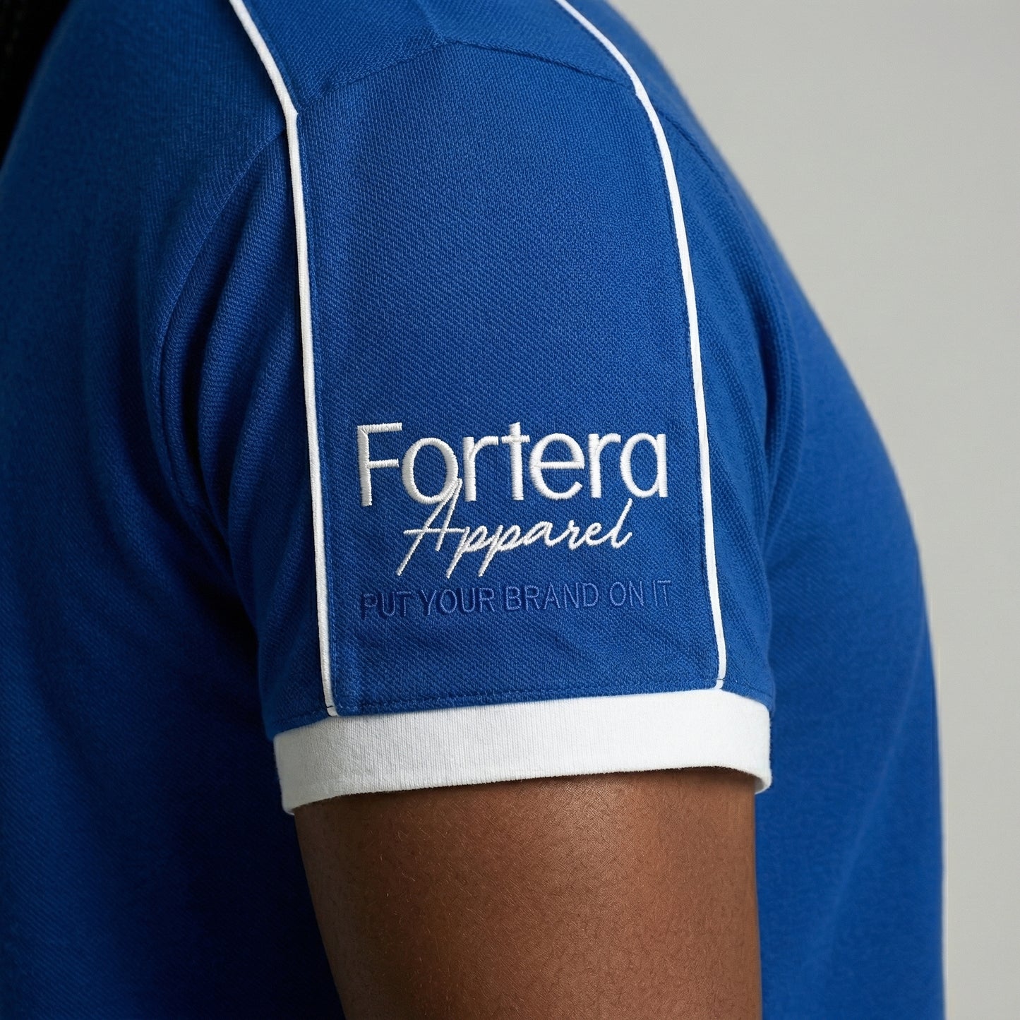 Royal blue embroidered polo shirt with white shoulder piping detail - team uniform group