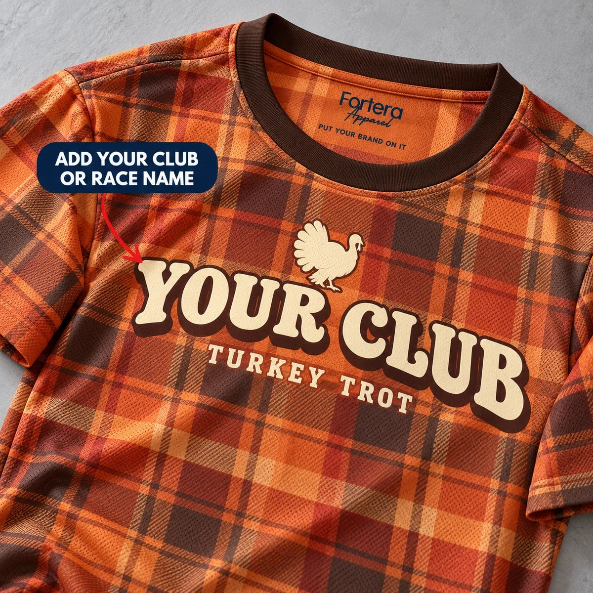 Close-up of the Harvest Plaid Turkey Trot Shirt design and neck label