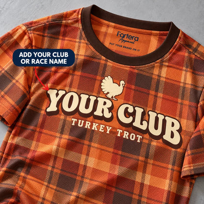 Close-up of the Harvest Plaid Turkey Trot Shirt design and neck label