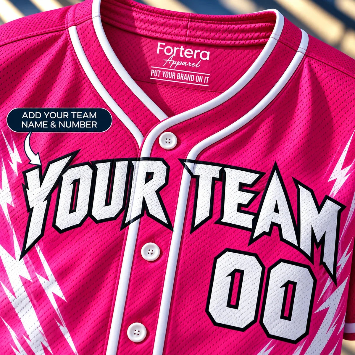Close-up of the Hot Pink Bolt pink softball jersey lettering and piping