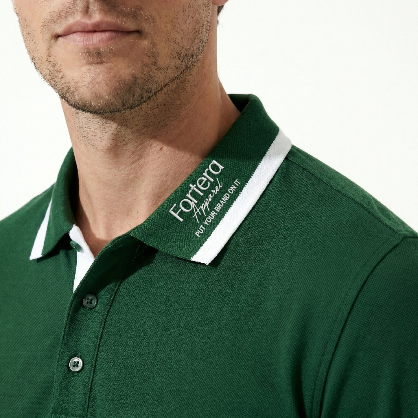 Forest green long sleeve polo shirt with white collar tipping and embroidered logo - logo embroidery detail