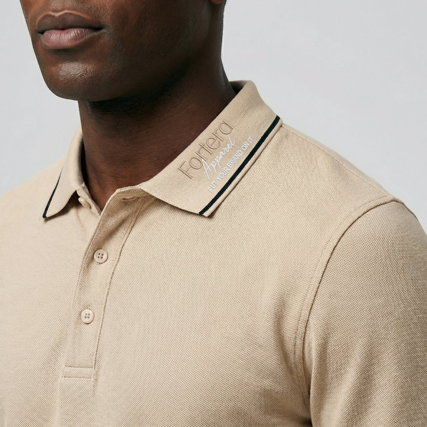 Beige long sleeve work polo shirt with embroidered logo and dark contrast tipping - logo embroidery detail
