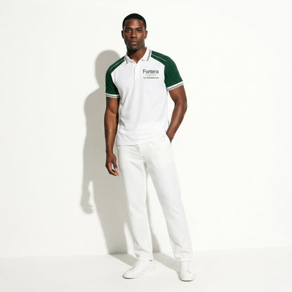 White moisture wicking polo uniform with forest green two-tone shoulder panel - detail close-up