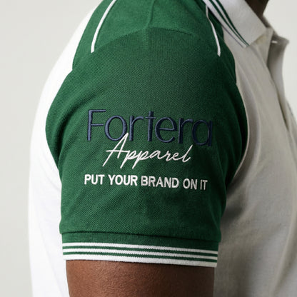 White moisture wicking polo uniform with forest green two-tone shoulder panel - logo embroidery detail