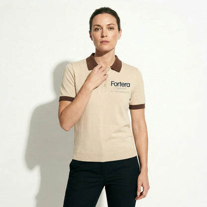 Beige polo shirt with company logo and dark brown contrast tipping on collar and cuffs - detail close-up