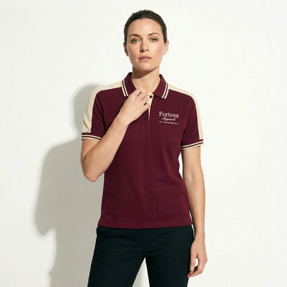 Burgundy polo shirt with company logo and cream shoulder panel accent - female fit