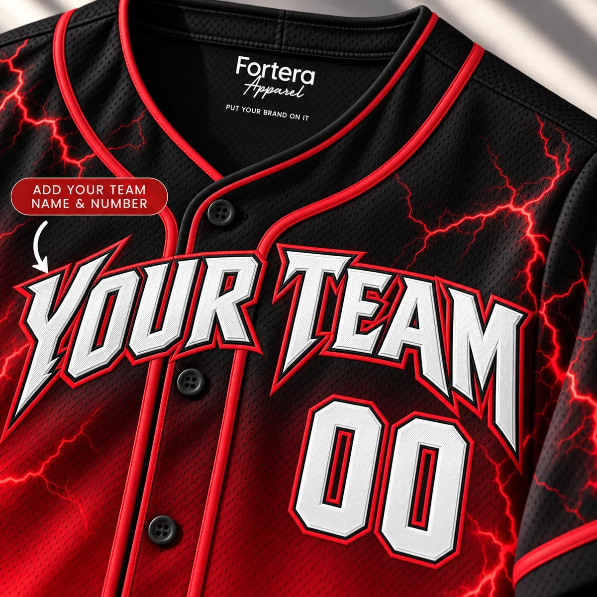 Close-up of the Red Lightning black and red baseball jersey lettering and piping