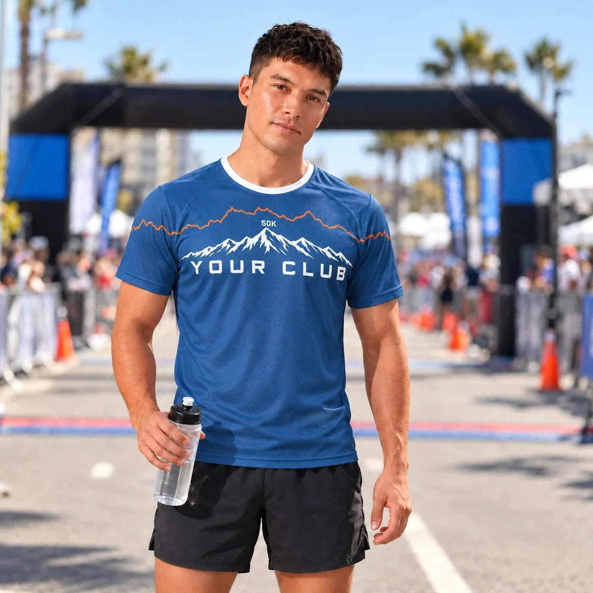 Runner wearing the Ridgeline Ultra Marathon Shirt at a race finish line