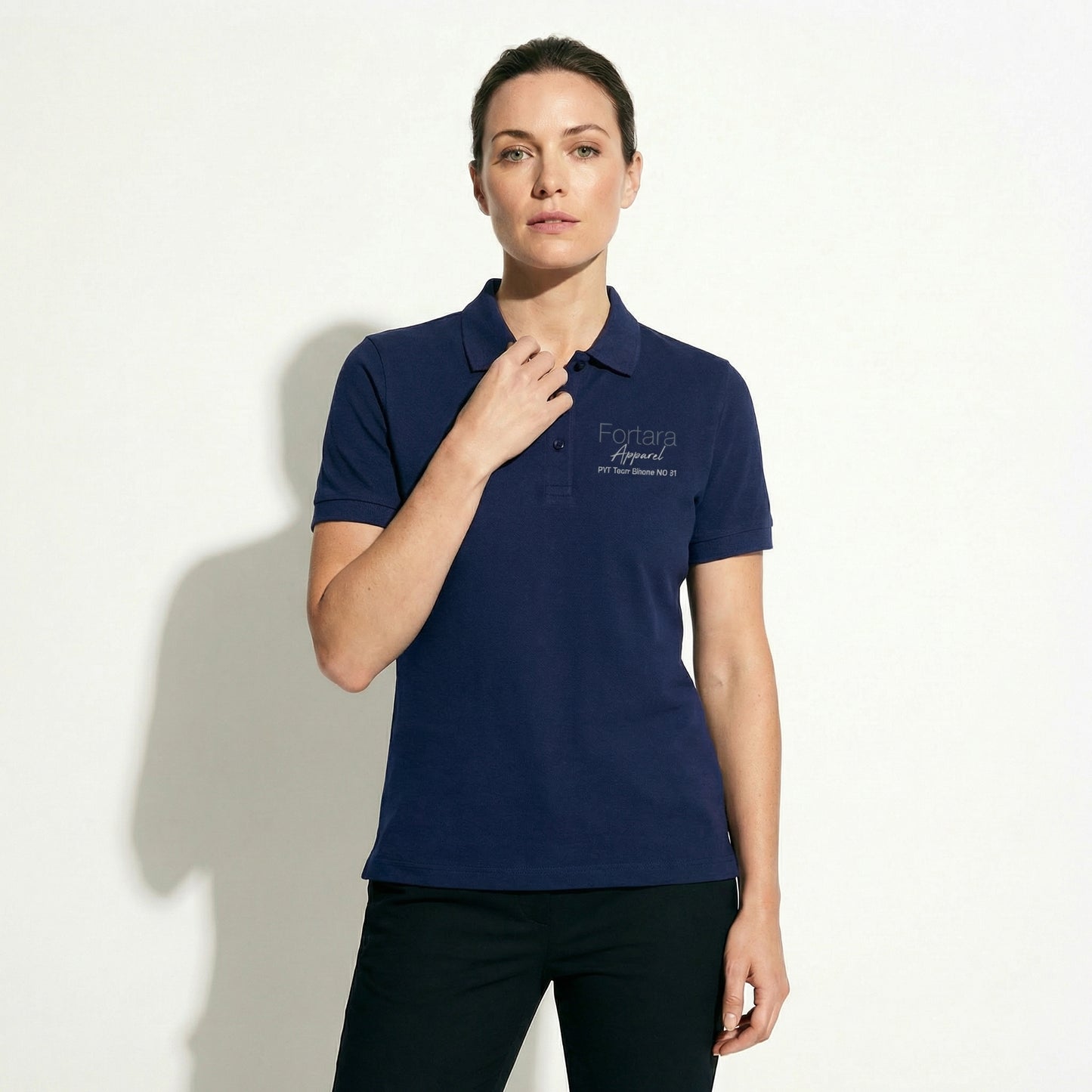 Solid navy custom embroidered polo shirt clean minimal design - detail close-up