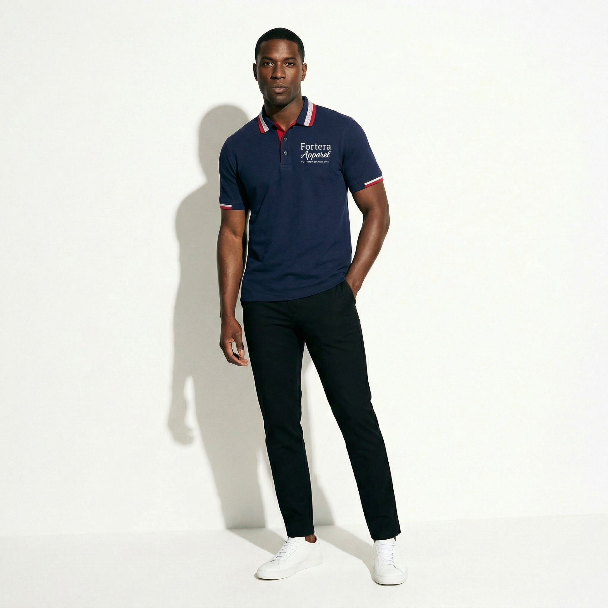 Navy polo shirt with embroidered logo and red white stripe tipping on collar - female fit