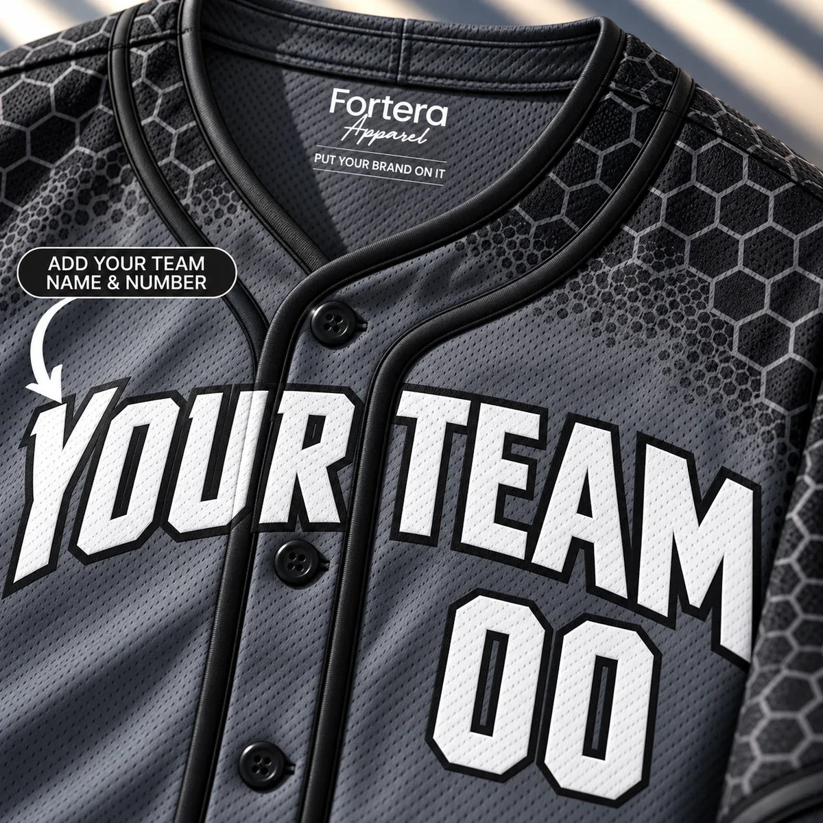 Close-up of the Tactical Charcoal mens softball jersey lettering and piping