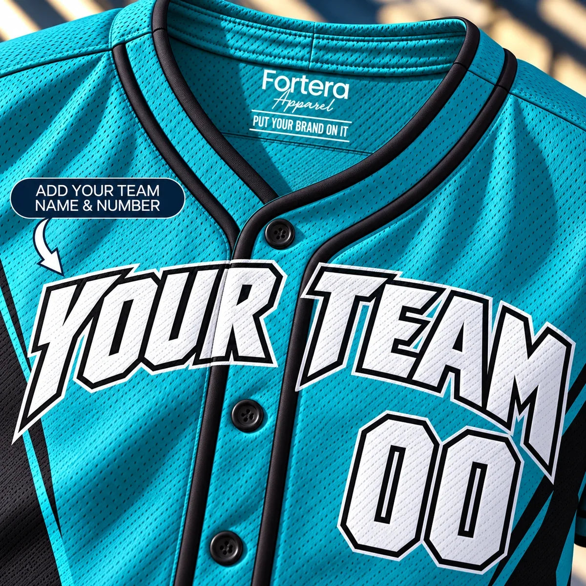 Close-up of the Teal Power Panel fastpitch softball jersey lettering and piping