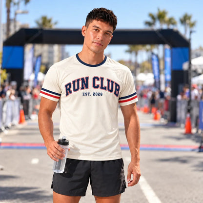 Runner wearing the Varsity Arch Run Club Shirt at a race finish line