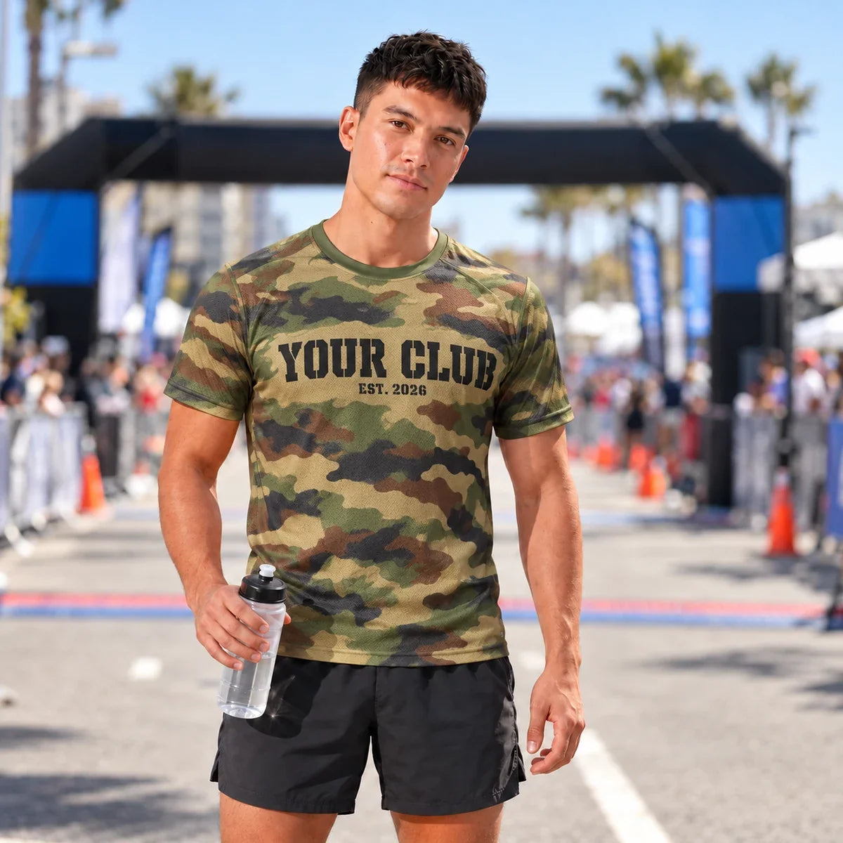 Runner wearing the Woodland Trail Camo Running Shirt at a race finish line