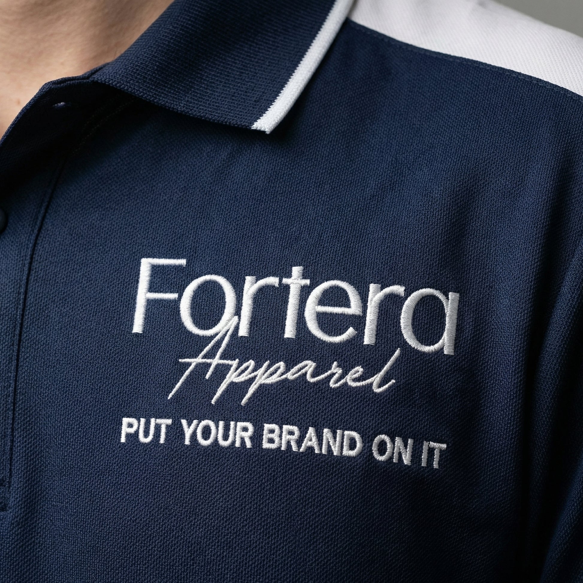Navy work polo shirt with embroidered logo and white shoulder block panel - male fit