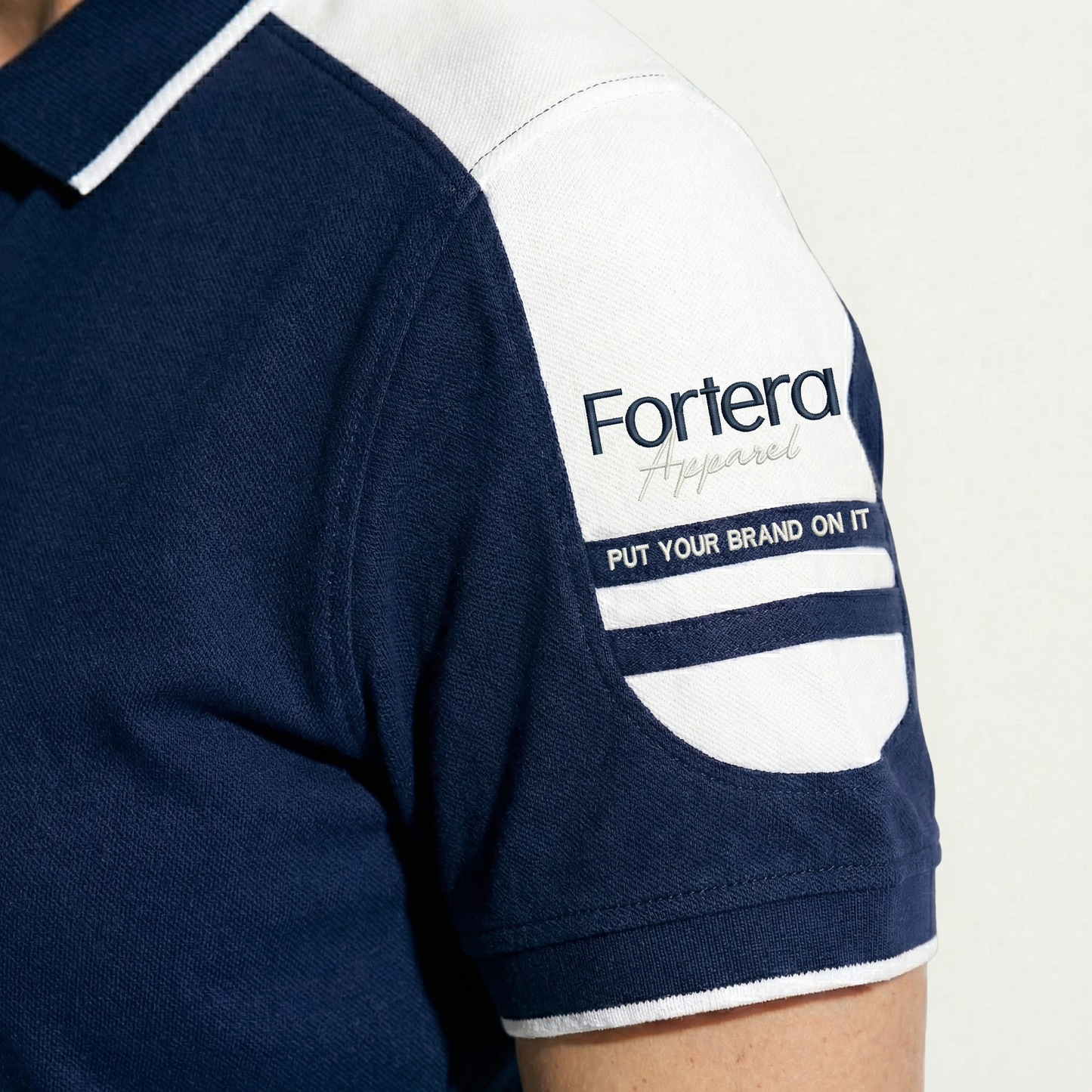 Navy work polo shirt with embroidered logo and white shoulder block panel - team uniform group