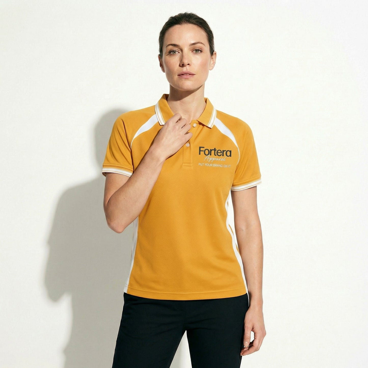 Amber yellow work polo shirt with embroidered logo and white shoulder panel - detail close-up