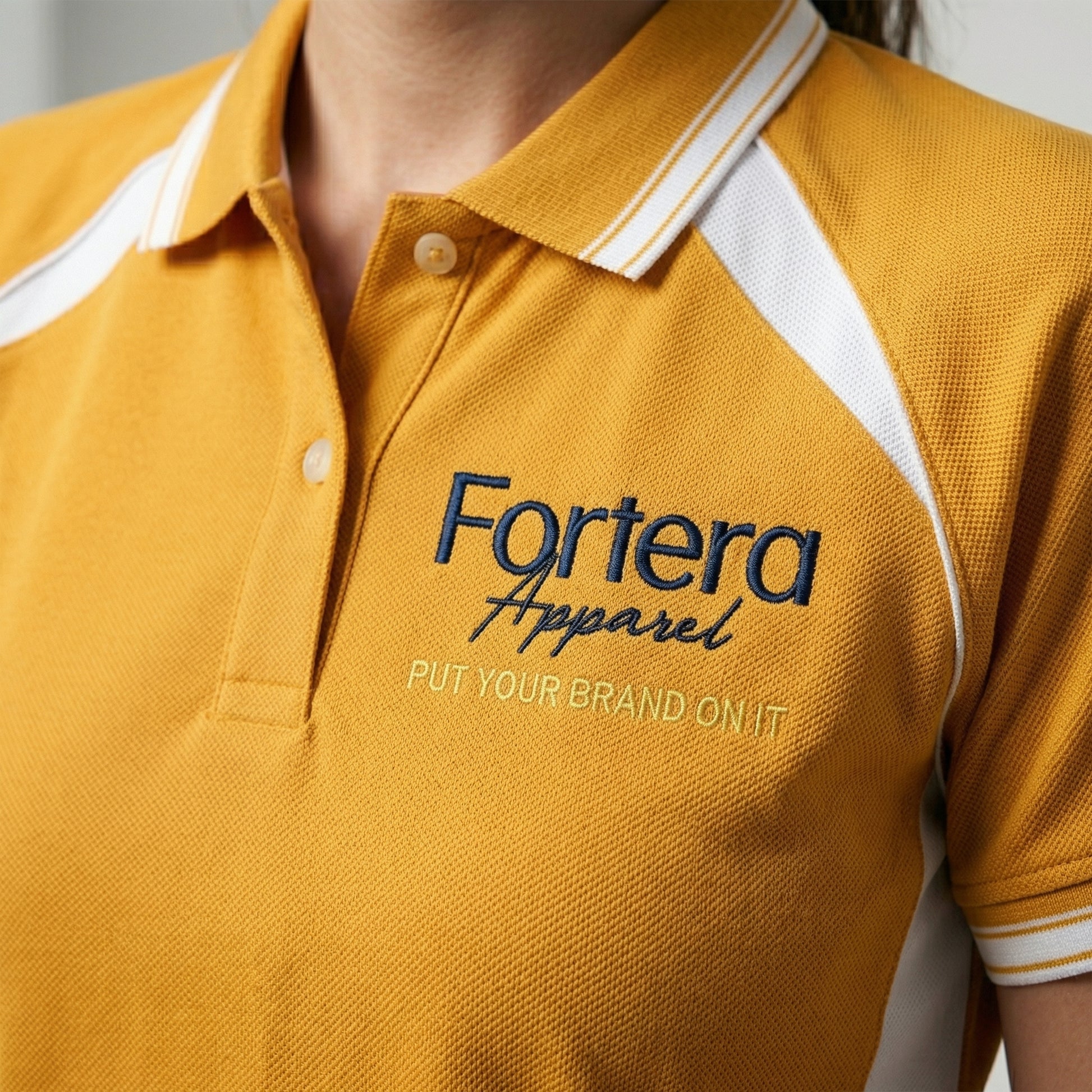 Amber yellow work polo shirt with embroidered logo and white shoulder panel - male fit